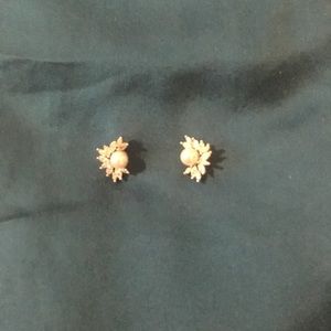 Pearl and diamond earrings.